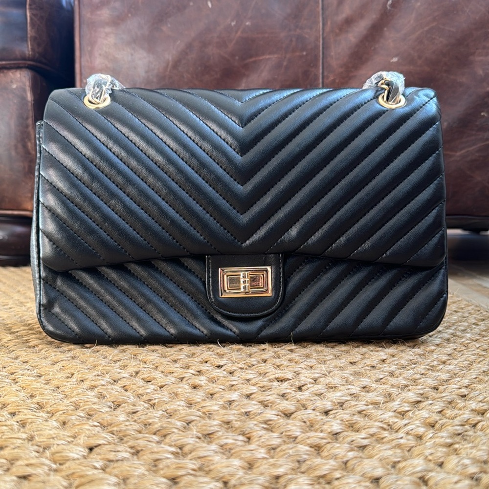 NWT Caleesa Black Quilted faux leather purse withh gold hardware.